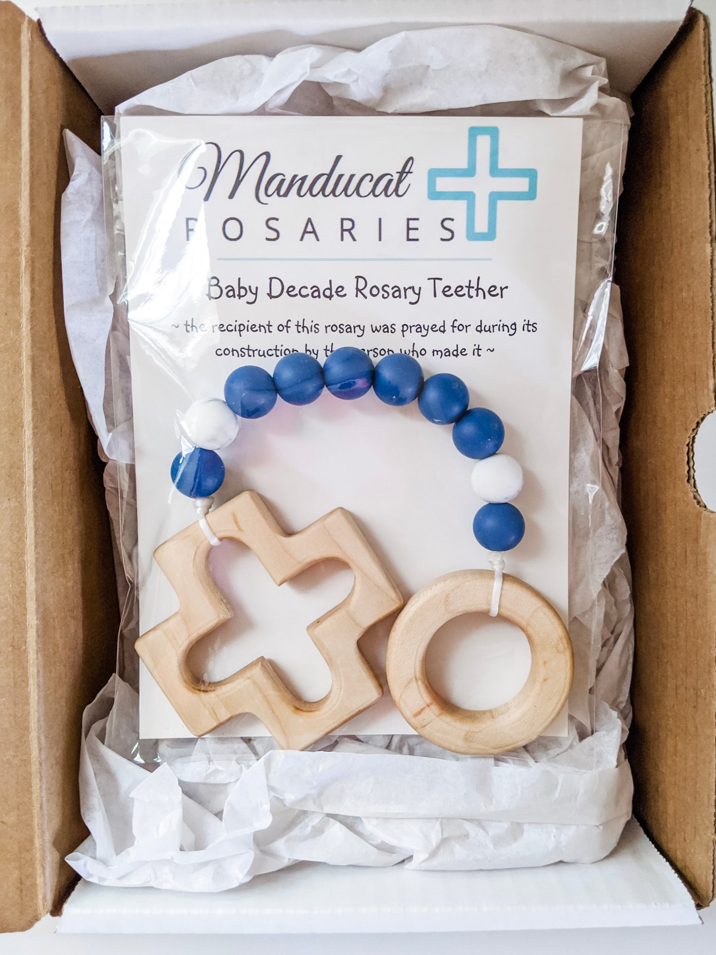 Blue and white marble teething rosary in packaging