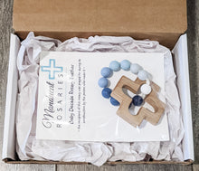 Load image into Gallery viewer, Catholic teething ring in packaging stating baby was prayed for during item&#39;s construction
