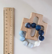 Load image into Gallery viewer, Teething ring with cross wood piece next to ruler
