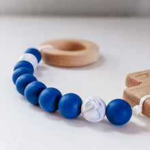 Load image into Gallery viewer, Close up of teething rosary in blue and marble white
