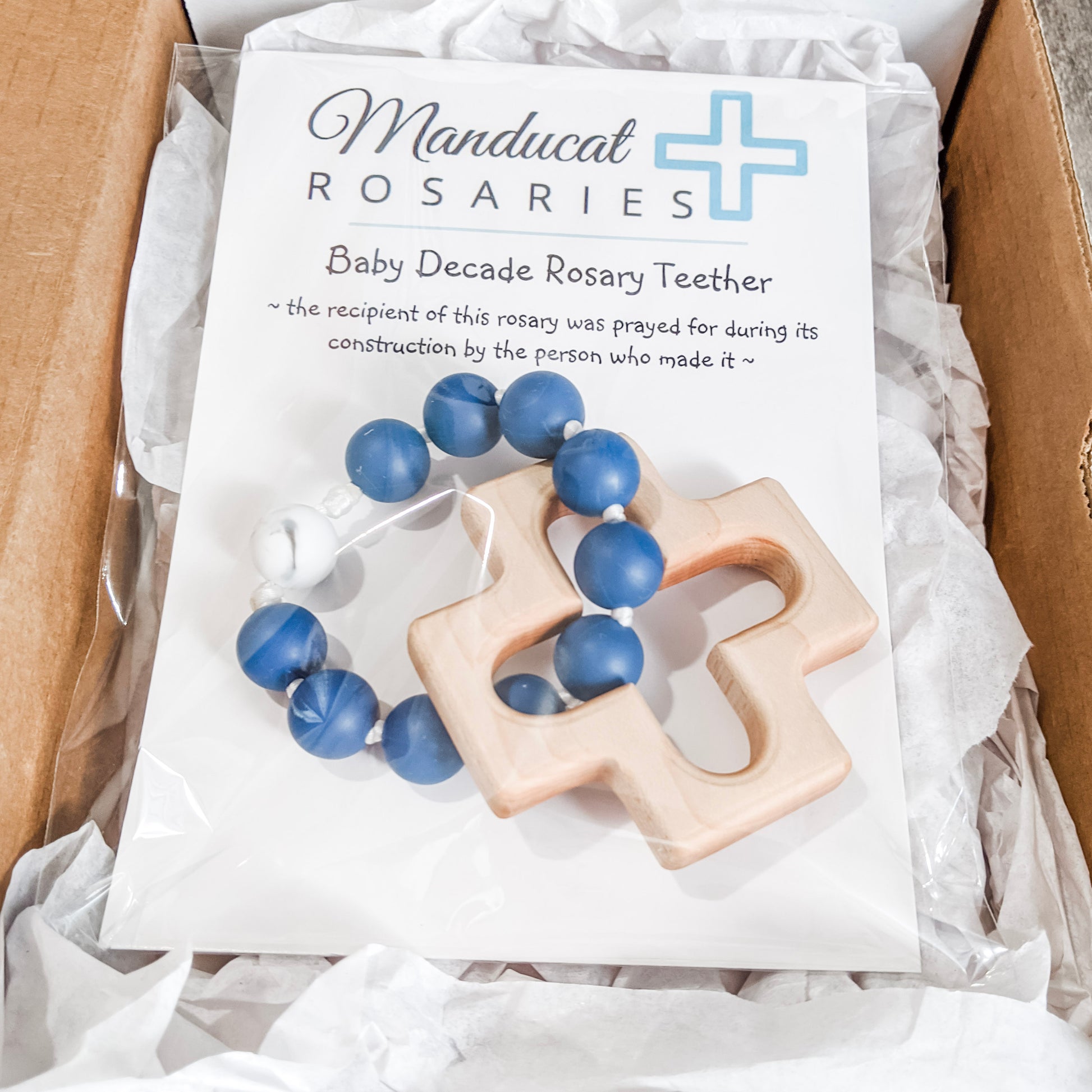 Baby boy baptism gift in packaging that says baby was prayed for during item's construction