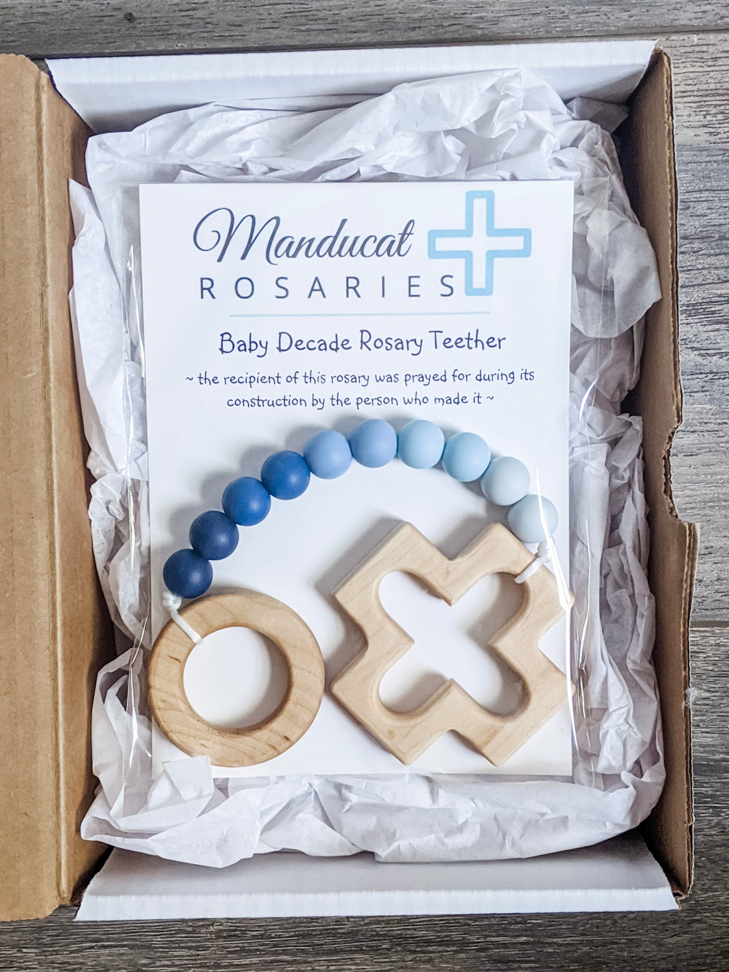 Baby boy baptism gift in packaging that says baby was prayed for during item's construction