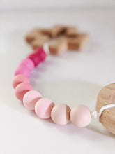 Load image into Gallery viewer, Close up of light pink in ombre teething rosary strand
