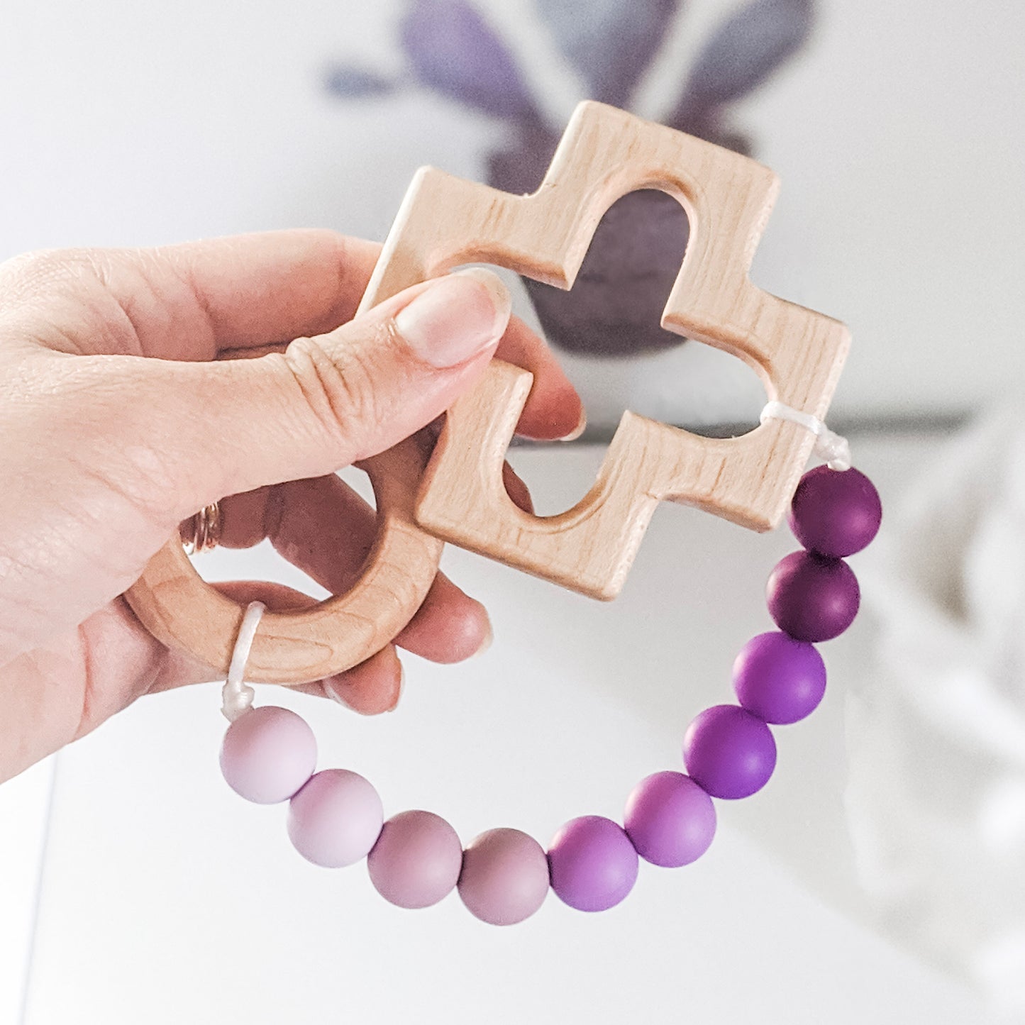 Catholic teething rosary strand in purple ombre with wooden cross and ring teethers